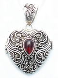 Suarti filigree silver locket with garnet 